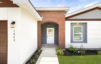 the front door of a home with a garage door