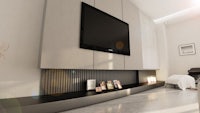 a modern living room with a tv on the wall